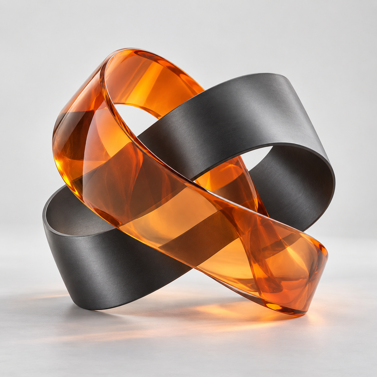 Amber and charcoal ribbons joining into one sculptural form